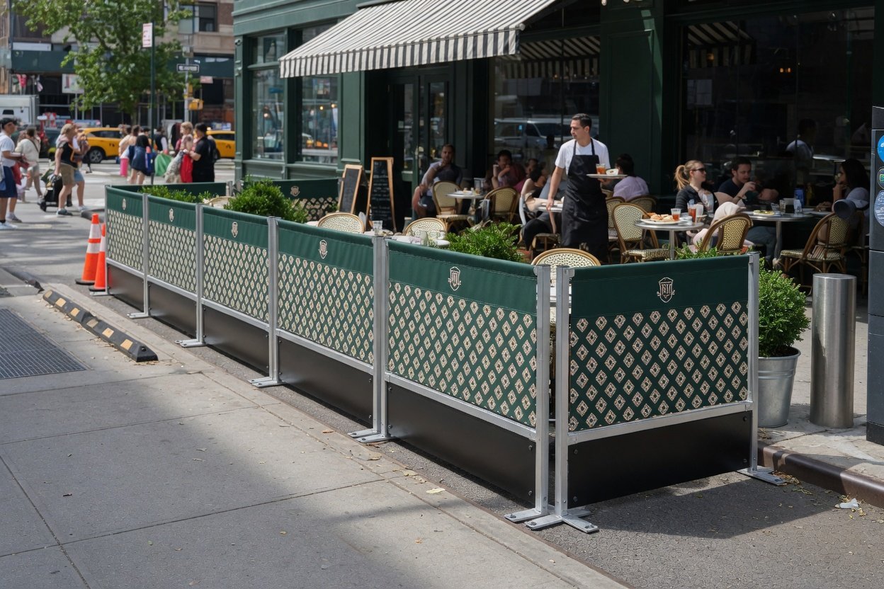 Sidewalk cafe barriers for sale at NYC sign fabrication shop